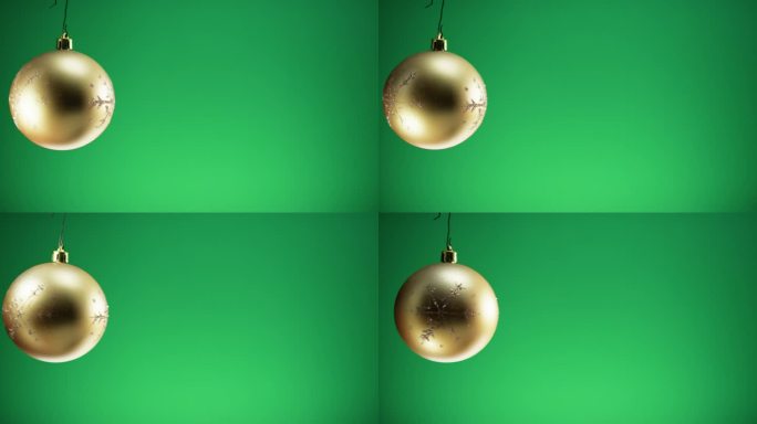 绿色背景的圣诞金球装饰