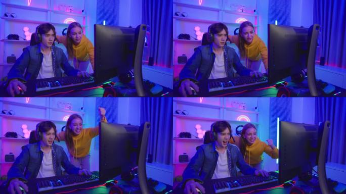 高加索电竞夫妇在电脑上玩在线视频游戏。帅哥游戏玩家感到快乐和兴奋，享受科技直播，同时在家里玩网络比赛