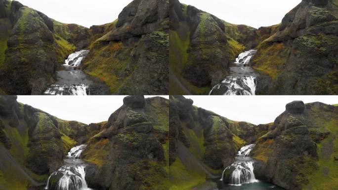 冰岛翠绿的岩石峡谷和激流的斯约纳福斯瀑布。