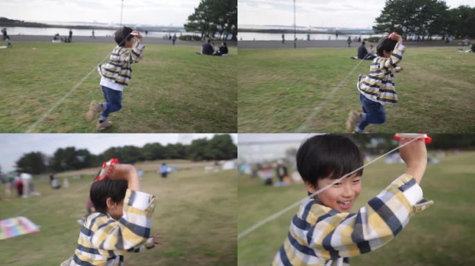 小男孩在海边公园放风筝