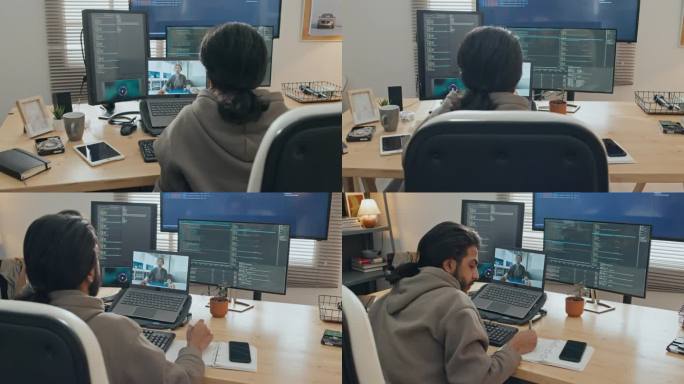 男程序员在家工作时与同事视频通话