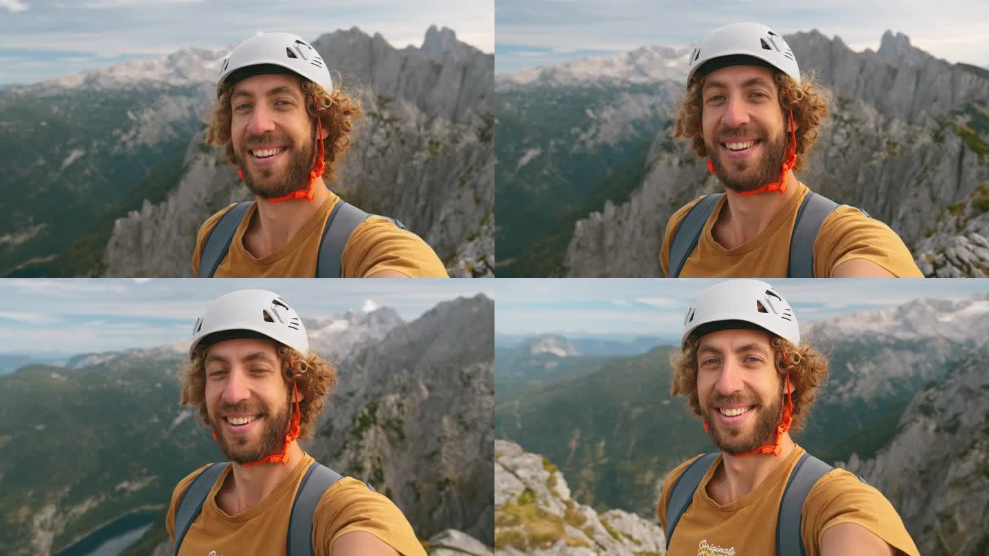 登山后男子在山顶的自拍照