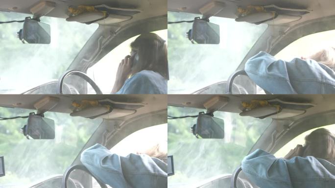 亚洲女人的车在路上坏了打开散热器引擎盖的车和更多的烟