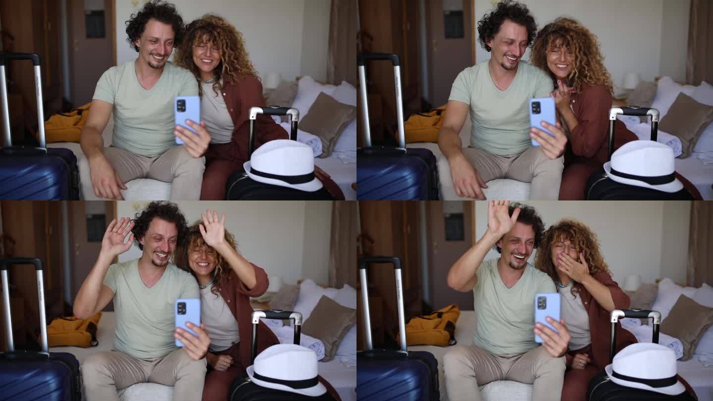 一对恩爱的夫妇在酒店房间里和他们的朋友进行视频通话，玩得很开心
