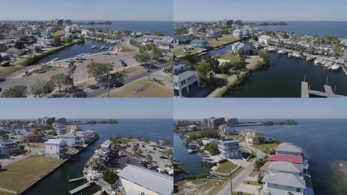 4K无人机视频(高速多莉拍摄)在运河上的海滨住宅在墨西哥湾的墨西哥湾