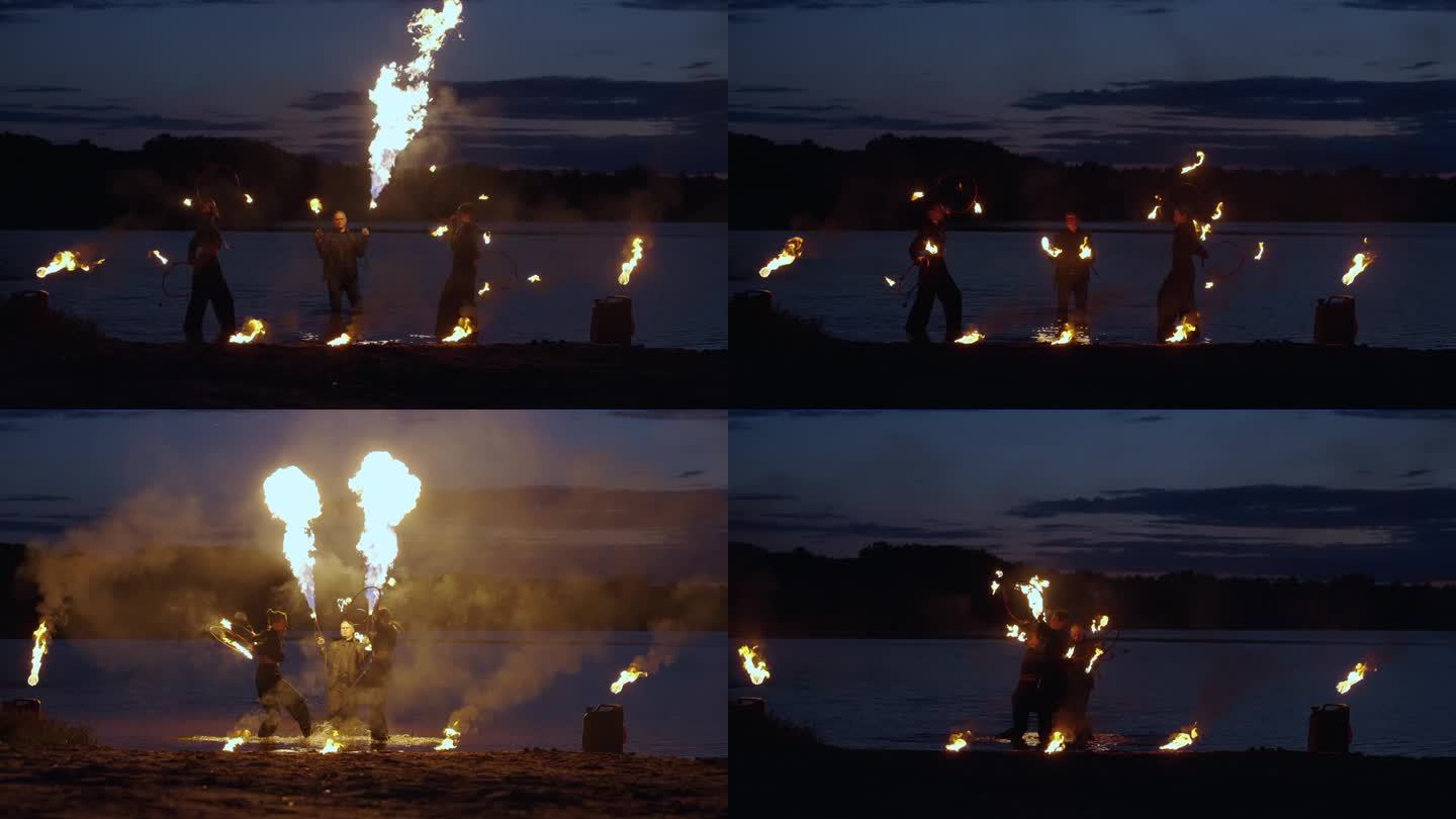 夏夜，马戏演员在河岸上表演火种，电影慢动作