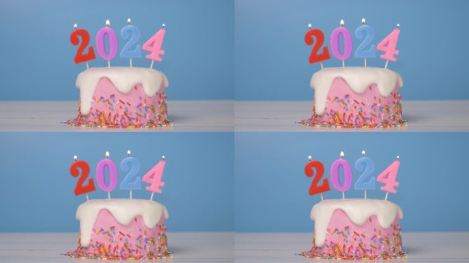 2024年新年快乐，可爱的蛋糕与彩色蜡烛编号2024年新年庆祝派对的无缝循环，火焰在烛芯摇摆和闪烁，