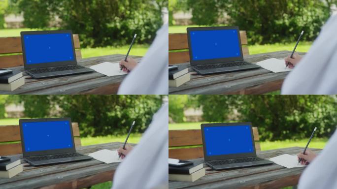 学生在网上讲课时做笔记，蓝屏