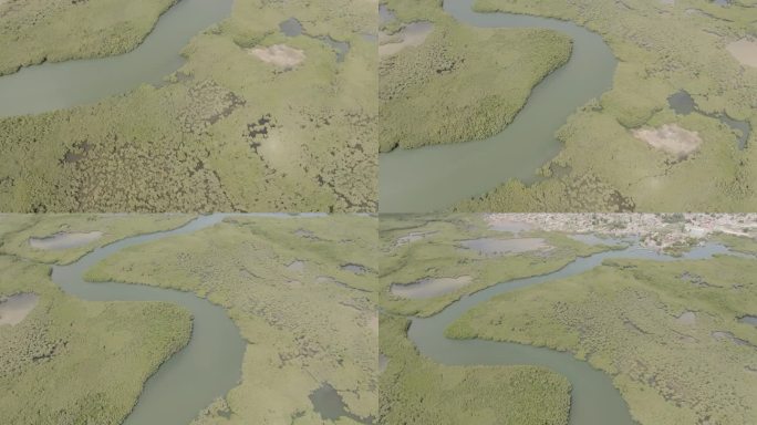 缓慢的空中飞行的甘比河流经冈比亚的水森林，显示班珠尔镇