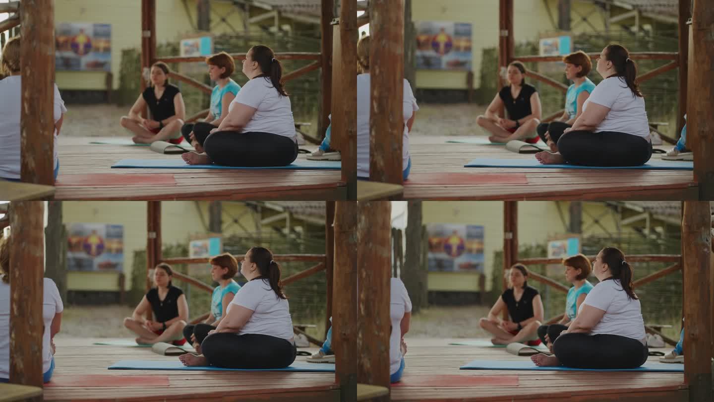 瑜伽放松运动，女性团体健身课程，体型大而苗条的人训练
