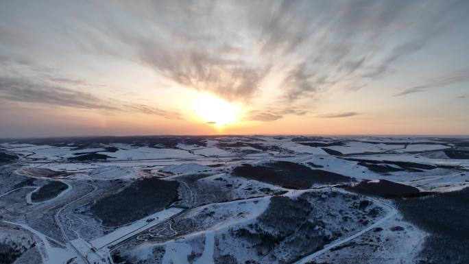 丘陵山地雪景日暮航拍