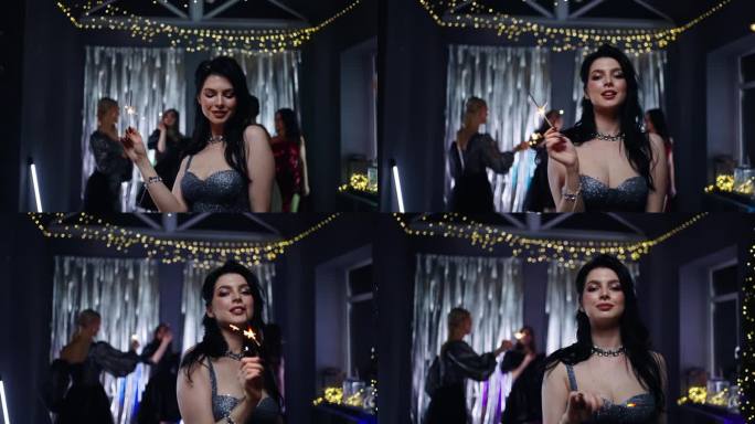 性感的黑发女士拿着烟花，在夜总会跳舞，在圣诞假期，乐趣和欢乐