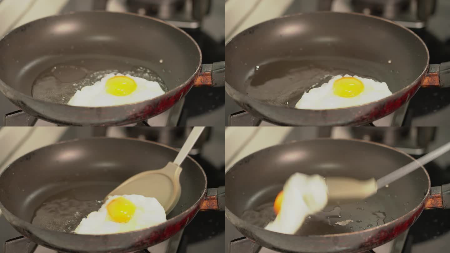 4K用锅铲翻动锅里的煎鸡蛋实拍视频