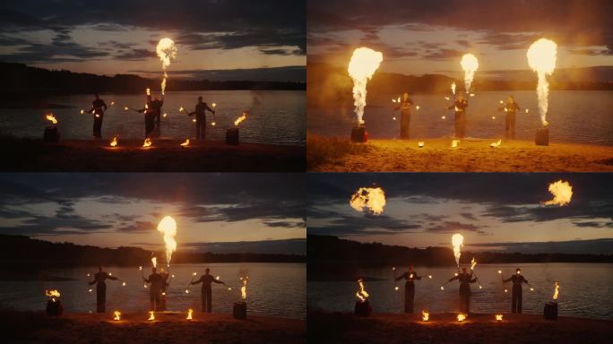 日落后的湖岸专业火场表演，姑娘们旋转火堆的剪影