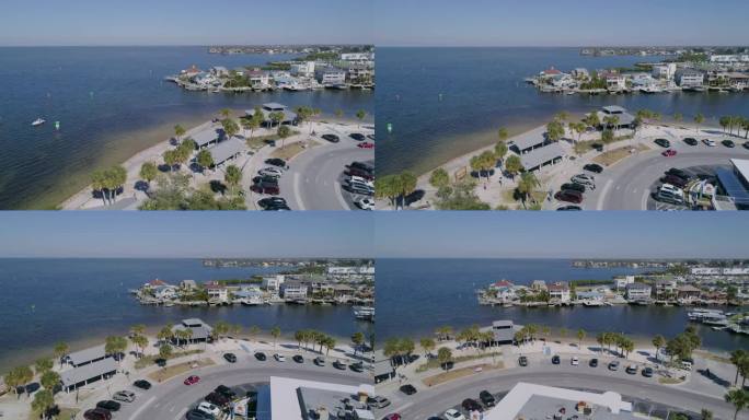 4K无人机视频(卡车拍摄)在墨西哥湾哈德逊海滩运河上的海滩和海滨住宅