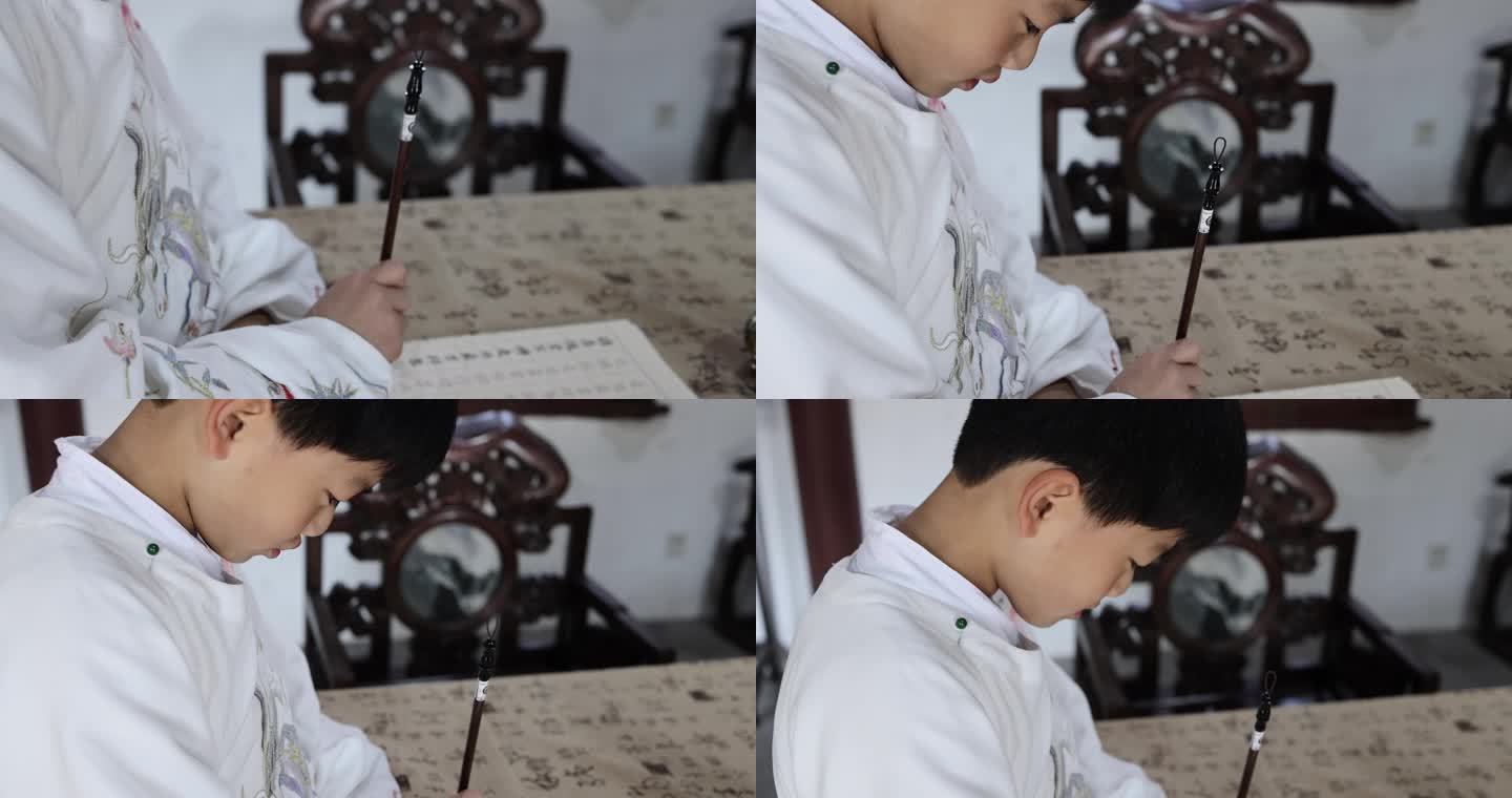 可爱的汉服男孩在写毛笔字
