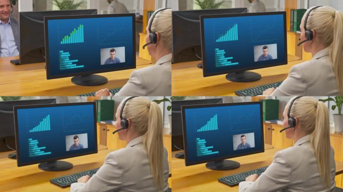 一位女士坐在办公室里，用她的电脑进行视频通话
