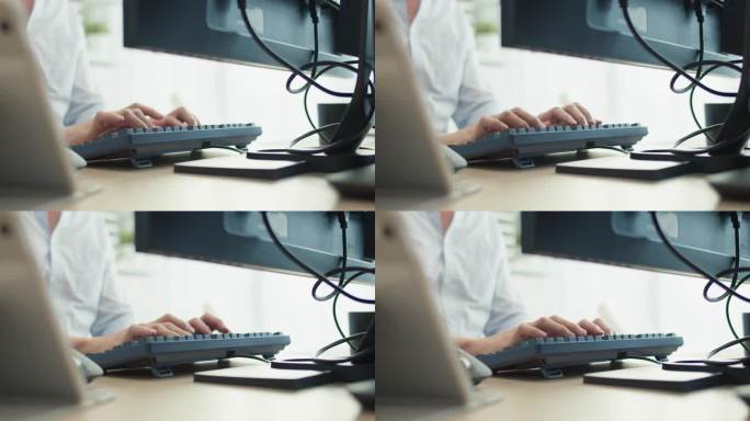 特写镜头:用手打电脑键盘，写程序，上网，在办公室工作。