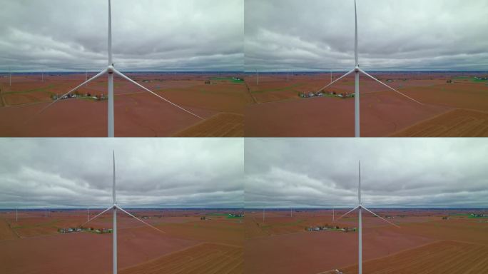停滞不前的风力涡轮机在爱荷华州风电场中脱颖而出，叶片仍然存在，爱荷华州新沙龙