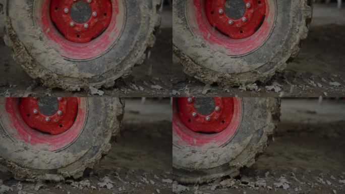 泥泞拖拉机轮胎车轮特写视图驾驶的框架在慢动作电影