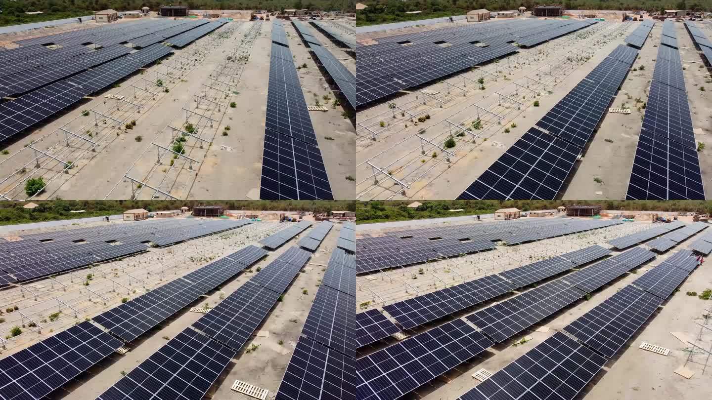 在西非冈比亚，正在建设中的Jambur太阳能发电厂，空中低空滑过清洁的光伏阵列