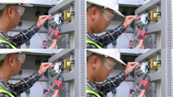 电工工程师工作测试仪，用于测量电气控制柜中电力线路的电压和电流。电工维修工作。