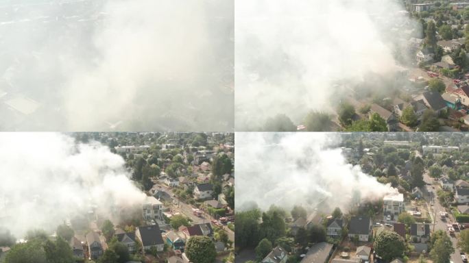 盘旋的空中镜头穿过房屋火灾的烟雾