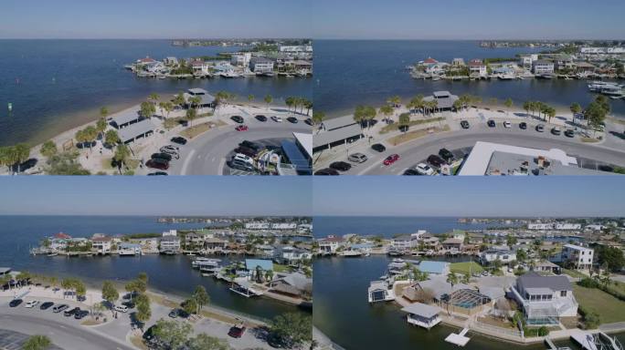 4K无人机视频(高速多莉拍摄)的海滩公园，码头，并在哈德逊海滩海滨住宅在墨西哥湾在佛罗里达州