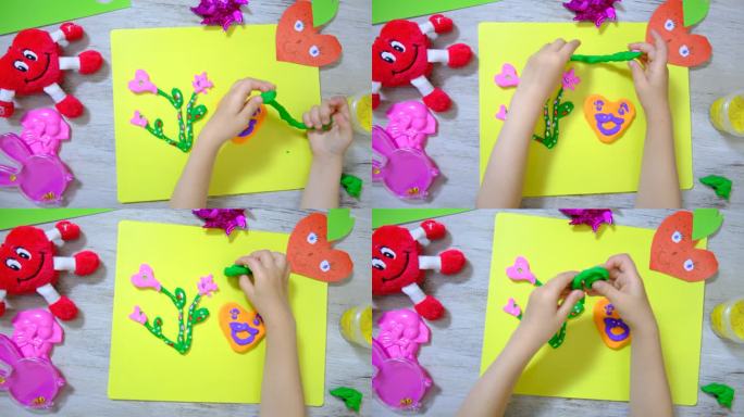 孩子用纸、粘土、橡皮泥制作有趣的工艺品。鲜花和爱心作为母亲节、父亲节、生日或情人节的礼物。工艺美术概