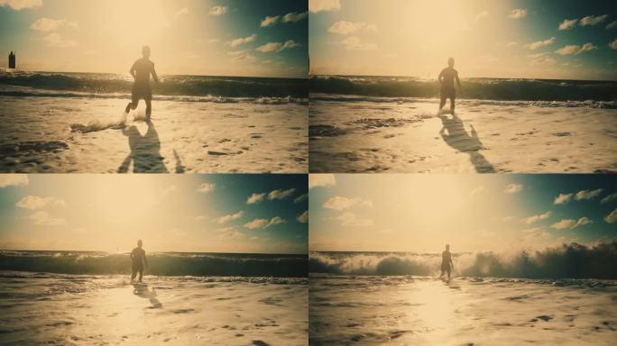 无忧无虑的男人在阳光明媚的海浪中奔跑和戏水