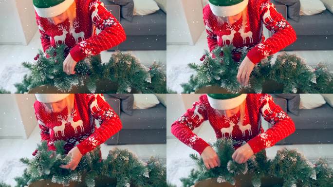 美丽的女孩穿着红色毛衣，画着传统的圣诞驯鹿，仔细地检查并打开一棵新圣诞树