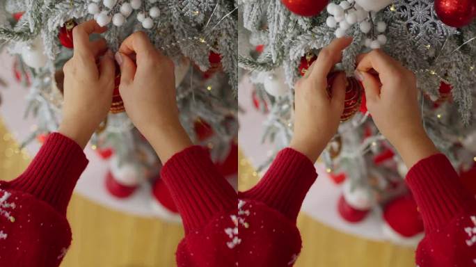 一个女人紧紧抓住圣诞树上的玩具