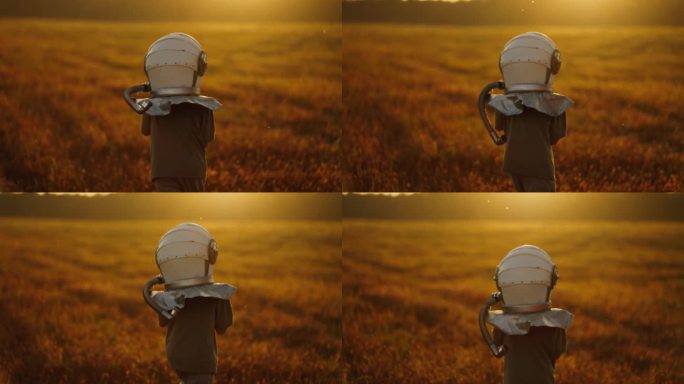 日落时分，小宇航员在田野里，小男孩梦想着太空旅行