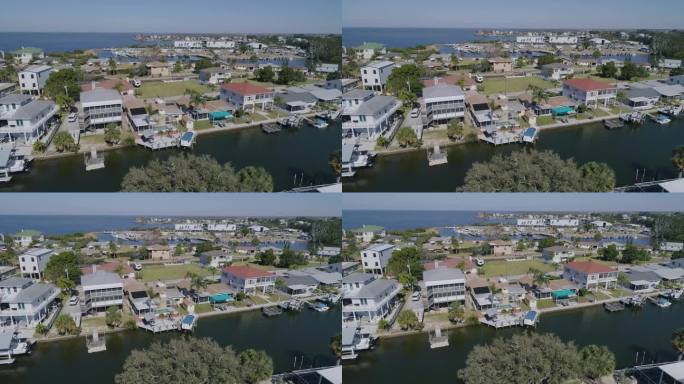 4K无人机视频(倾斜拍摄)在运河上的滨水区住宅在墨西哥湾的墨西哥湾