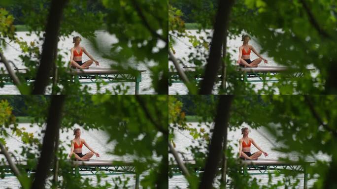 在湖边运动的女人。在海边的木码头上做瑜伽呼吸练习