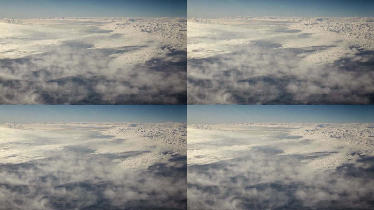 从宇宙飞船上鸟瞰地球。从绕地球运行的宇宙飞船上俯视云层，阳光照在地球的云顶上，就像电影里的慢动作一样