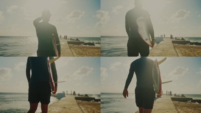 男冲浪者手持冲浪板沿着阳光明媚的海滩漫步