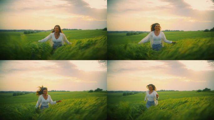 微笑的年轻女子在夕阳下奔跑在绿色的麦田里