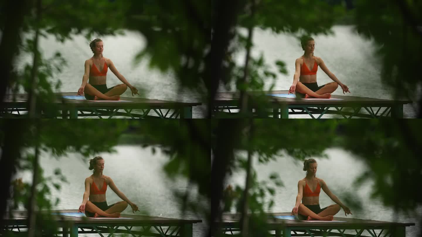 在湖边运动的女人。在水边冥想