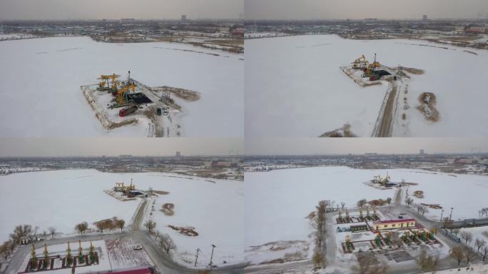 航拍大庆油田大雪过后的采油作业的繁忙景象