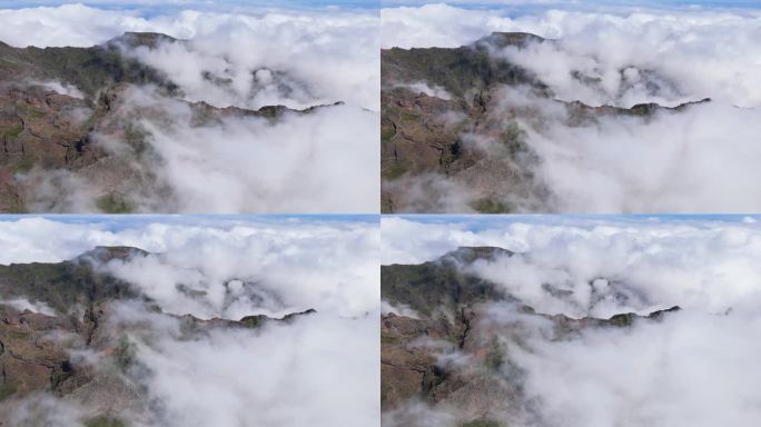 史诗般的马德拉岛景观从空中透视。巨大的岩石山峰覆盖着漂浮的云。阳光明媚的白天，在Pico do Ar