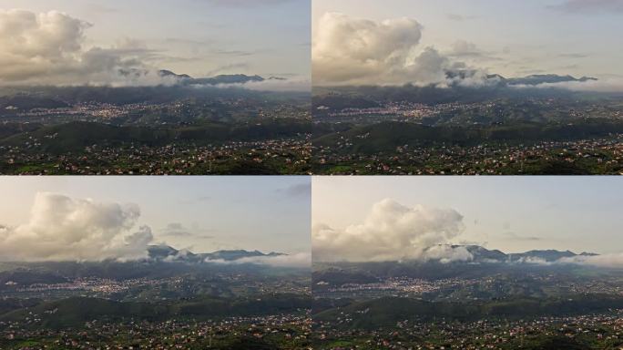 西西里岛的山脉和巴勒莫镇，鸟瞰图。云流