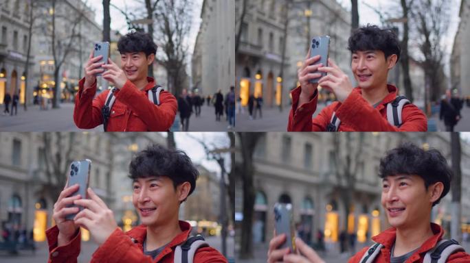 亚洲背包客用手机拍摄美丽的风景。年轻的男性游客独自在城市的街道上旅行，用手机记录在瑞士度假旅行的视频