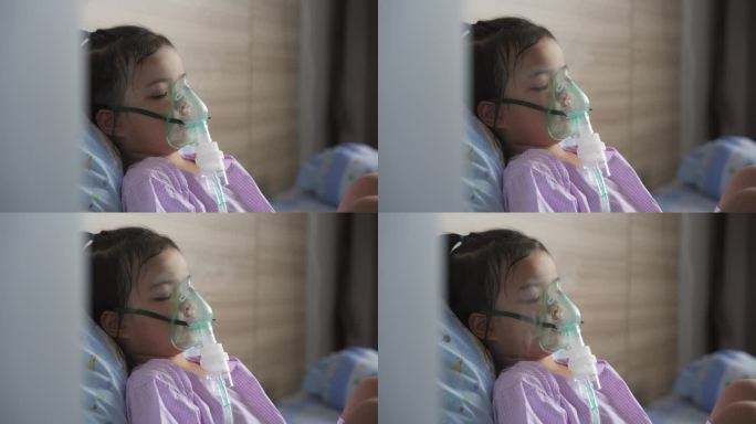 一个勇敢的亚洲小女孩正在用口罩呼吸。哮喘的治疗