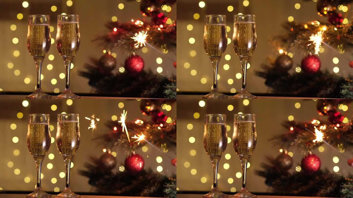 庆祝新年前夜的派对上有孟加拉灯和香槟，背景是圣诞树和闪烁的灯泡花环的散景。寒假，节日心情，祝酒