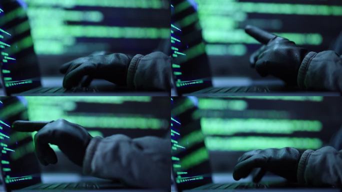 近距离黑客在电脑上打字，黑客侵入数据中心的机密数据。
