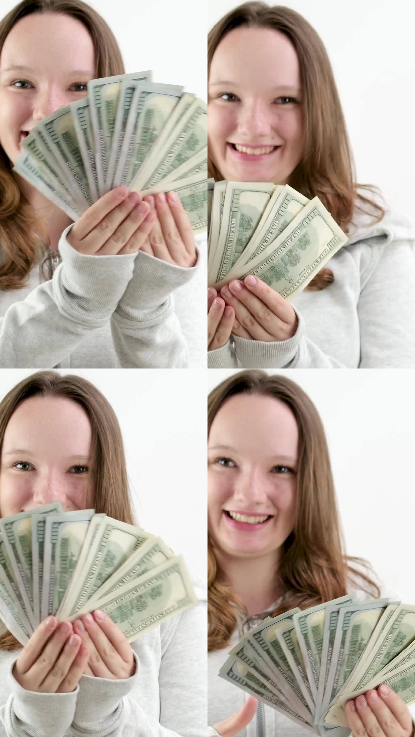 一个少年的快乐第一次钱赚了很多美元100美元的钞票一捆一个女孩在框架里展示钱笑笑开心地张开嘴一个好礼