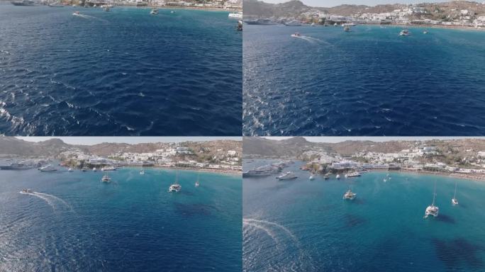 米科诺斯岛海岸线的航拍视频，酒店和游艇停泊在米科诺斯岛海岸