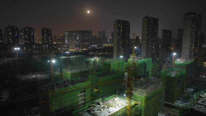 城市大楼建设建筑工地塔吊夜间航拍