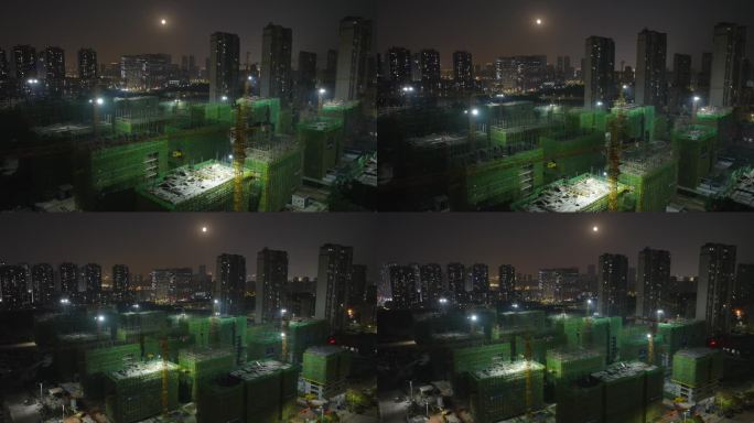 城市大楼建设建筑工地塔吊夜间航拍